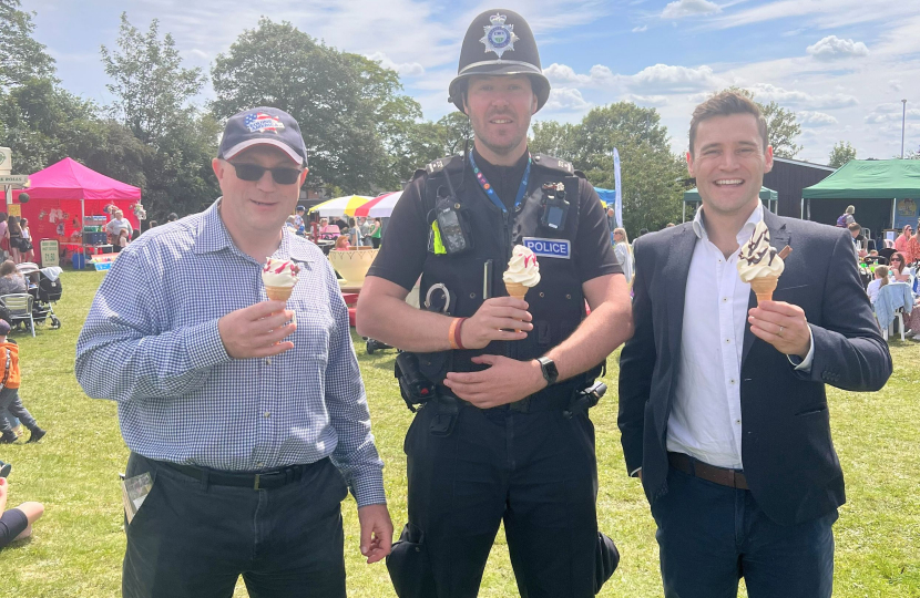 Dr Luke Evans MP, a local police officer and Cllr Allen at Shilton by the Sea