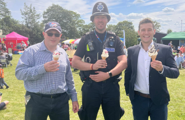 Dr Luke Evans MP, a local police officer and Cllr Allen at Shilton by the Sea